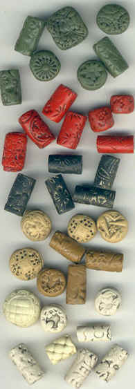 beads made of polymer clay that look like ivory, cinnabar, bakelite and jade