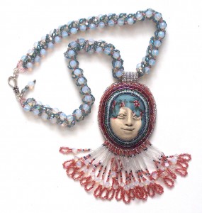 Laura Sandoval beaded necklace polymer clay face
