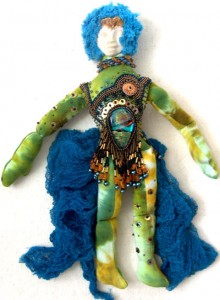 green tiedyed fabric and beads spirit doll with dichroic glass