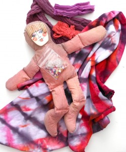 tiedyed cloth ribbons and ceramic face spirit doll
